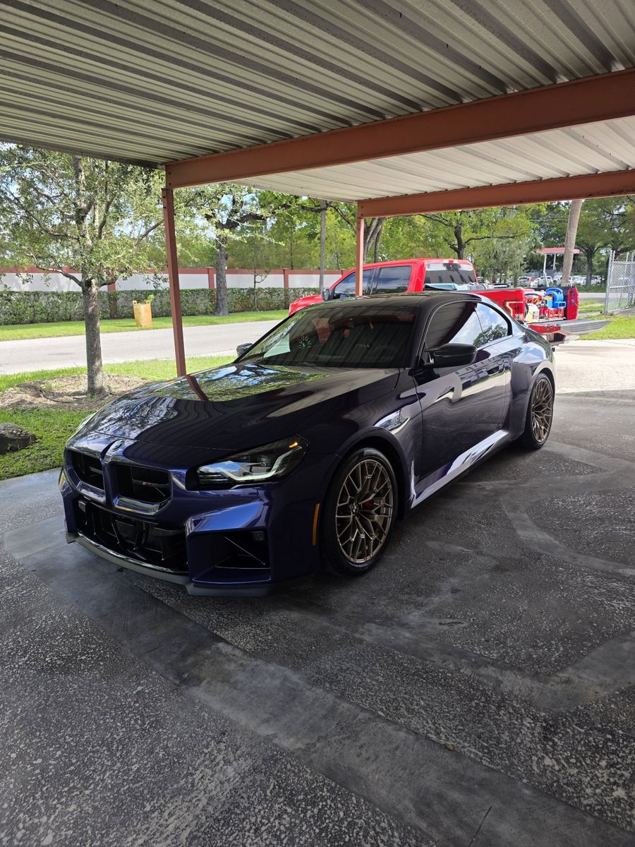 Blue BMW M2 after a mobile detail, clean and glossy