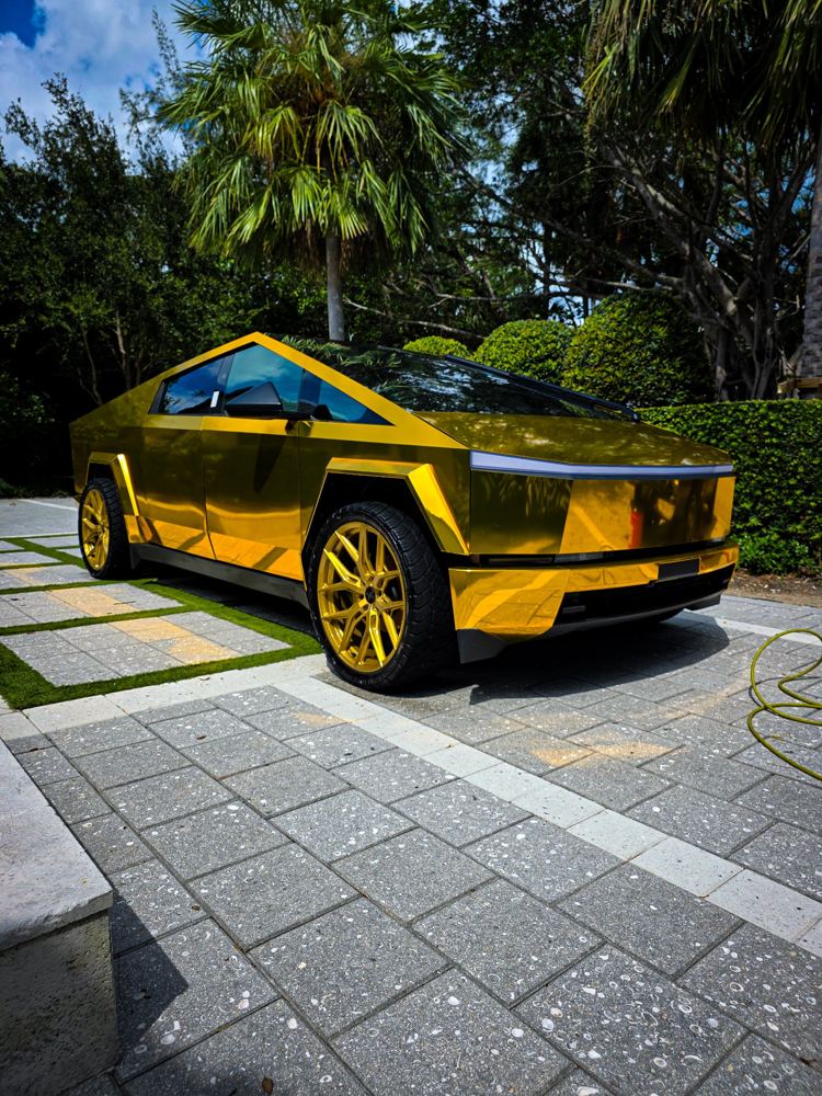 Gold chrome-wrapped Tesla Cybertruck after a wash